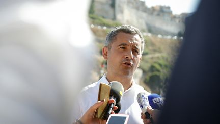 Le ministre de l'Intérieur Gérald Darmanin à Bonifacio en Corse, le 23 juillet 2022. (PASCAL POCHARD-CASABIANCA / AFP)