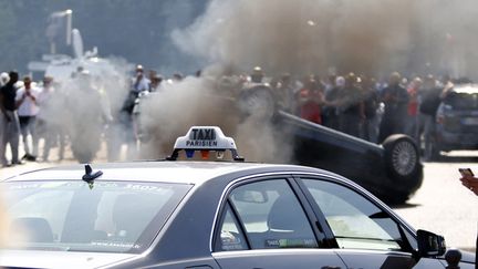 &nbsp; (Les manifestations des chauffeurs de taxi ont souvent été émaillées d'incidents, comme ici à Paris, porte Maillot © Charles Platiau/Reuters)