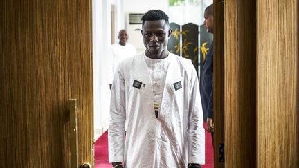 Mamoudou Gassama arrivant à une rencontre avec le président du Mali, Ibrahim Boubacar Keïta, le 18 juin 2018 à Bamako. (MICHELE CATTANI / AFP)