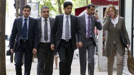 Nasser Al-Khelaifi (C), le pr&eacute;sident du PSG et d'Al-Jazira Sport, le 13 juillet 2011 &agrave; Paris. (FRED DUFOUR / AFP)