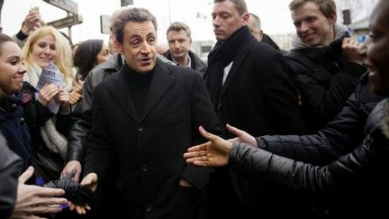 Nicolas Sarkozy sortant de son siège de campagne, rue de la Convention, à Paris, le 15 février2012. (AFP - Lionel Bonaventure)