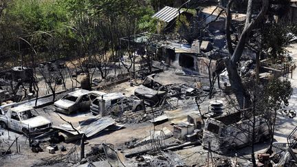 &nbsp; (Les violents incendies qui ont détruit mercredi plus de 3.000 hectares de garrigue au nord de Marseille, sont désormais maîtrisés, laissant un paysage désolé de collines calcinées et d'habitations noircies © AFP)