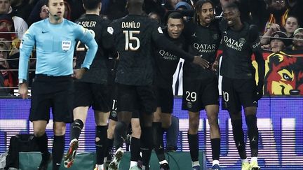 Bradley Barcola, surrounded by his teammates, celebrates his opening score against Lens, Sunday January 14, 2024. (SAMEER AL-DOUMY / AFP)