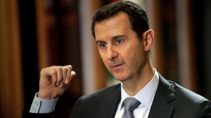 Bachar Al-Assad en 2014, lors d'une&nbsp;interview à&nbsp;l'AFP (JOSEPH EID / AFP)