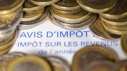 Les m&eacute;nages fran&ccedil;ais verseront 10 milliards d'imp&ocirc;ts suppl&eacute;mentaires en 2013, a annonc&eacute; Fran&ccedil;ois Hollande dimanche 9 septembre. (JOEL SAGET / AFP)