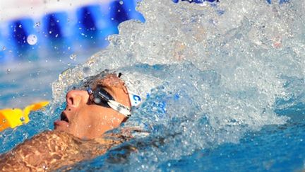 Camille Lacourt et Jérémy Stravius, co-médaillés d'or du 100m dos  (DANIEL MIHAILESCU / AFP)