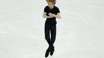 Le Canadien Kevin Reynolds lors du programme court de patinage artistique aux Jeux olympiques de Sotchi (Russie), le 13 f&eacute;vrier 2014. (ISSEI KATO / REUTERS)