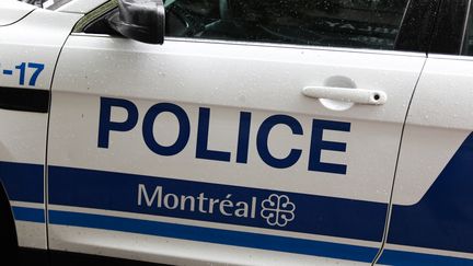 Une voiture de police à Montréal, le 13 juin 2023. Photo d'illustration. (JAKUB PORZYCKI / AFP)