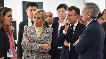 Emmanuel et Brigitte Macron, lors de l'inauguration du Centre Pompidou West Bund Museum, à Shanghai, le 5 novembre 2019. (HECTOR RETAMAL / POOL)