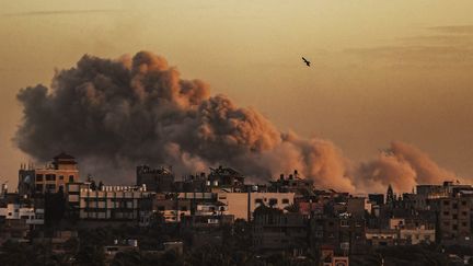 Smoke rises from Deir al-Balah, in the central Gaza Strip, on January 13, 2024. (ALI JADALLAH / ANADOLU / AFP)