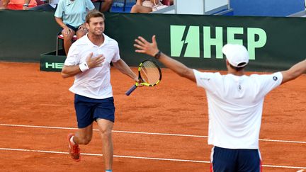 La joie des Américains Mike Bryan et Ryan Harrison (STR / AFP)