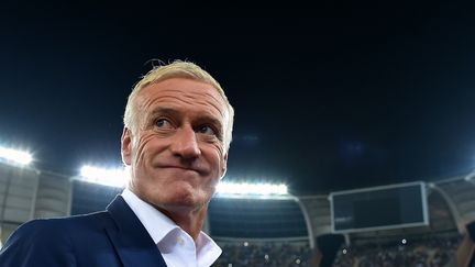 Didier Deschamps, satisfait de la performance de ses joueurs face à l'Italie (ALBERTO PIZZOLI / AFP)