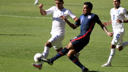 Les États-Unis face au Honduras lors du match pour les qualifications olympiques, le 28 mars 2021.  (ULISES RUIZ / AFP)