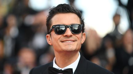 Orlando Bloom est venu sur le tapis rouge du film Le Traitre, de Marco Bellocchio. Il vient aussi défendre le film And We Go Green. (LOIC VENANCE / AFP)