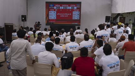 Congress Party supporters watch the vote counting procedure on a television in New Delhi, India, June 4, 2024 (ALTAF QADRI/SIPA)