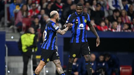 Dimarco and Thuram, celebrating with Inter against Atlético de Madrid, March 13, 2024 (BURAK AKBULUT / ANADOLU)