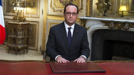 Le pr&eacute;sident, Fran&ccedil;ois Hollande, le 31 d&eacute;cembre 2014, au palais de l'Elys&eacute;e, &agrave; Paris. (IAN LANGSDON / AFP)