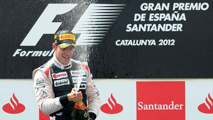 Le V&eacute;n&eacute;zu&eacute;lien Pastor Maldonado savoure sa victoire lors du Grand Prix d'Espagne, le 12 mai 2012, &agrave; Montmelo.&nbsp; (LLUIS GENE / AFP)