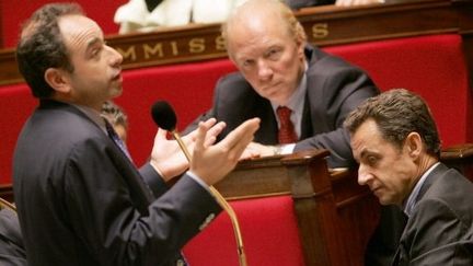 Nicolas Sarkozy, alors ministre de l'intérieur, Jean-François Copé, et Brice Hortefeux. (DOMINIQUE FAGET / AFP)