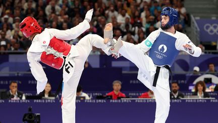 Georgii Gurtsiev et Cyrian Ravet, le mercredi 7 août, à Paris. (DAVID GRAY / AFP)