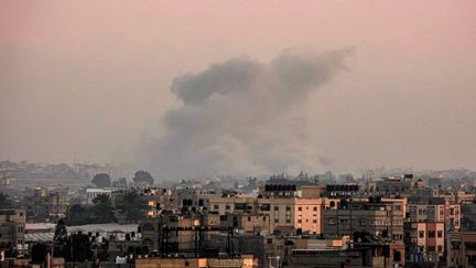 A photo taken in Rafah shows smoke rising from Khan Younes, Gaza, on January 23, 2024. (AFP)