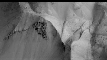 Capture d'écran du grand volcan Arsia Mons sur Mars filmé par la sonde Trace Gas Orbiter (TGO) de la mission russo-européenne ExoMars 2016, novembre 2016 (ESA Robotic Exploration of Mars / YOUTUBE)