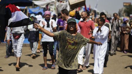Des membres des Fr&egrave;res musulmans manifestent au Caire (Egypte), le 7 ao&ucirc;t. (GIANLUIGI GUERCIA / AFP)