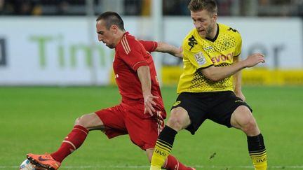 Franck Ribéry (Bayern Munich) en duel avec Jakub Blaszczykowski (Dortmund)