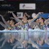 L'équipe de France de natation artistique durant son programme acrobatique lors de la deuxième étape de Coupe du monde, le 5 mai 2024, à Saint-Denis. (STEPHANE KEMPINAIRE / KMSP / AFP)