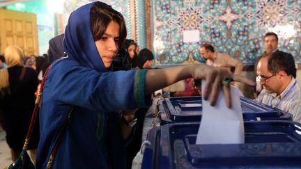 En Iran, les femmes peuvent voter, mais elles ne peuvent pas travailler sans l'accord de leur mari. (ATTA KENARE / AFP)