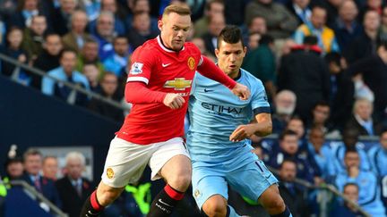 Duel de stars entre Wayne Rooney (United) et Sergio Agüero (City) (PAUL ELLIS / AFP)