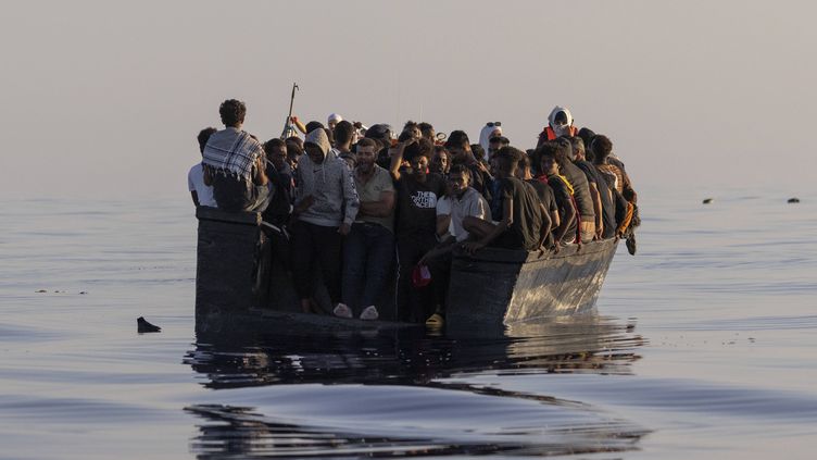 Migrants sail aboard a wooden boat before a rescue by the"ocean viking", on August 27, 2022, south of Lampedusa (Italy).  (JEREMIAS GONZALEZ/AP/SIPA)