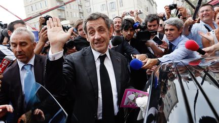 L'ancien pr&eacute;sident Nicolas Sarkozy &agrave; Nice (Alpes-Maritimes), le 27 septembre 2013, apr&egrave;s avoir donn&eacute; une conf&eacute;rence priv&eacute;e &agrave; Cannes. (VALERY HACHE / AFP)