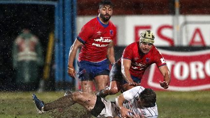 Les joueurs chiliens lors du match aller contre les Etats-Unis, le 9 juillet 2022 à Santiago. (JAVIER TORRES / AFP)