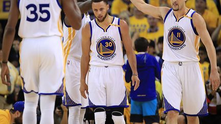 Draymond Green, Kevin Durant, Klay Thompson et Stephen Curry, quatre membres du cinq majeur des Warriors (EZRA SHAW / GETTY IMAGES NORTH AMERICA)