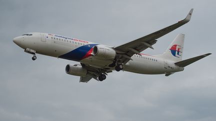 Un avion de la Malaysia Airlines, le 11 décembre 2014, à Kuala Lumpur (Malaisie). (MOHD RASFAN / AFP)