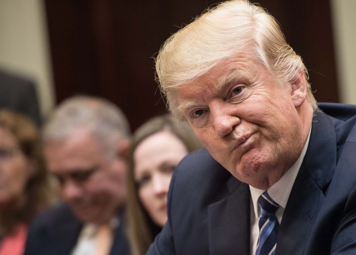 Le président américain Donald Trump lors d'une réunion du gouvernement à la Maison Blanche, à Washington (Etats-Unis), le 13 mars 2017. (NICHOLAS KAMM / AFP)