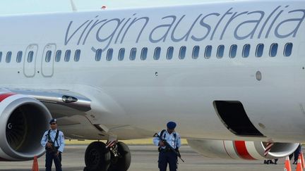 L'avion de la compagnie Virgin Australia &agrave; Bali (Indon&eacute;sie), le 25 avril 2014.&nbsp; (SONNY TUMBELAKA / AFP)