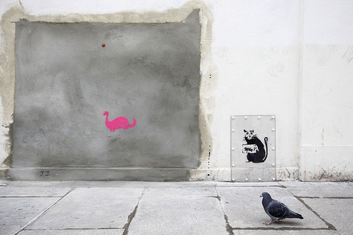 Un graffiti représentant un rat  sur le mur où a été retiré le graffiti de Banksy "Slave Labour", fevrier 2013 
 (JUSTIN TALLIS / AFP)