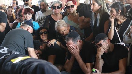 Relatives and friends mourn the body of Israeli-French citizen Céline Ben David Nagar, during her funeral in Holon, south of Tel Aviv, on October 17, 2023. (GIL COHEN MAGEN / AFP)