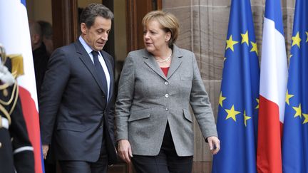 Nicolas Sarkozy et Angela Merkel apr&egrave;s le mini sommet europ&eacute;en organis&eacute; le 24 novembre &agrave; Strasbourg.&nbsp; (ERIC FEFERBERG/AFP)