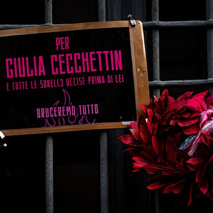 "For Giulia Cecchettin and all our sisters killed before her"can we read on this sign displayed on the gates of the University of Milan in Italy, November 22, 2023. (PIERO CRUCIATTI / AFP)