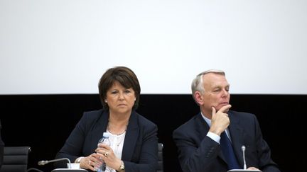 La premi&egrave;re secr&eacute;taire du PS, Martine Aubry et le Premier ministre, Jean-Marc Ayrault, le 22 mai 2012 &agrave; Paris.&nbsp; (FRED DUFOUR / AFP)