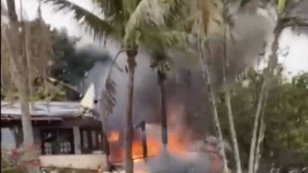 Flames rise from a plane that crashed near a house in Vinhedo, Sao Paulo state, Brazil, Friday, Aug. 9, 2024. (FELIPE MAGALHAES FILHO / AP / SIPA)