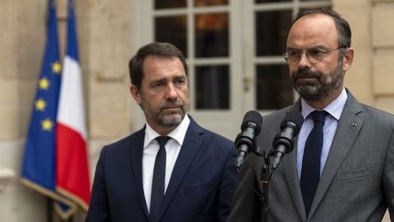 Le Premier ministre Edouard Philippe et le ministe de l'Intérieur, Christophe Castaner, présentent les conclusions du rapport à Matignon, à Paris, le 30 juillet 2019 (LIONEL BONAVENTURE / AFP)