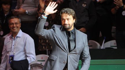 L'ancien tennisman Henri Leconte arrive pour la finale de la coupe Davis entre la France et la Suisse, au stade Pierre-Mauroy &agrave; Villeneuve-d'Ascq, le 23 novembre 2014. (PHILIPPE HUGUEN / AFP)