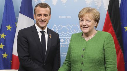 Emmanuel Macron et Angela Merkel, le 8 juin 2018. (LUDOVIC MARIN / POOL)