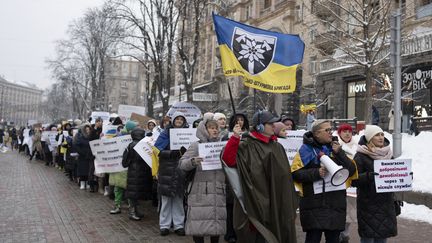 Wives of mobilized Ukrainian soldiers demonstrate so that they can return home, December 2, 2023 in kyiv.  (MYRIAM RENAUD / HANS LUCAS / HANS LUCAS via AFP)