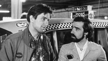 Robert de Niro et Martin Scorsese (à droite), le 15 juin 1976 sur le plateau de "Taxi Driver". (SNAP / REX FEATURES / REX / SIPA)