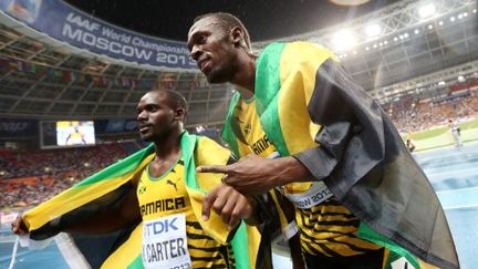 Nesta Carter aux côtés de Usain Bolt lors des Championnats du Monde de Moscou en 2013. (FRANCK FIFE / AFP)